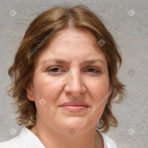 Joyful white adult female with medium  brown hair and blue eyes