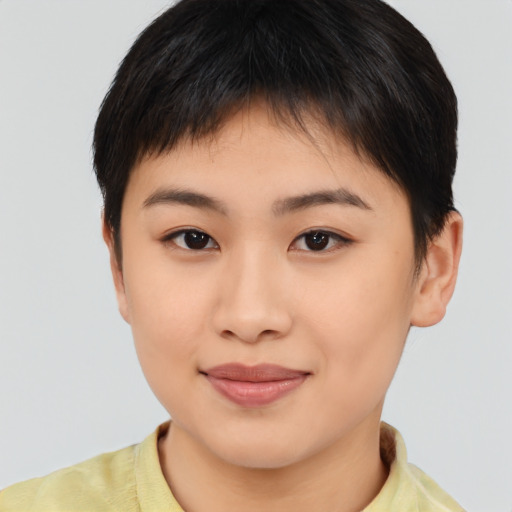 Joyful asian young-adult female with short  brown hair and brown eyes