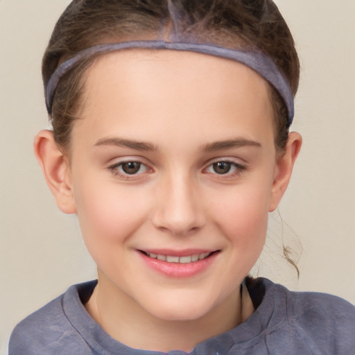 Joyful white child female with short  brown hair and brown eyes