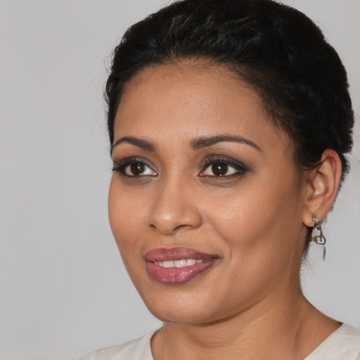 Joyful white young-adult female with short  black hair and brown eyes