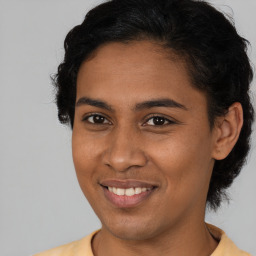 Joyful latino young-adult female with short  brown hair and brown eyes