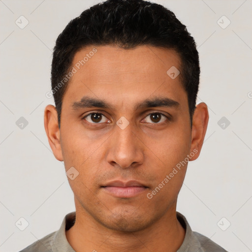 Neutral latino young-adult male with short  black hair and brown eyes