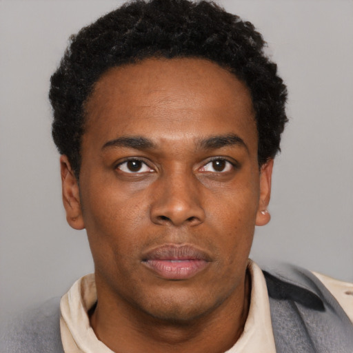 Neutral black young-adult male with short  black hair and brown eyes