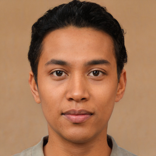 Neutral latino young-adult male with short  black hair and brown eyes