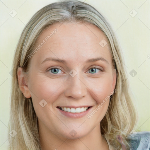 Joyful white young-adult female with long  brown hair and blue eyes