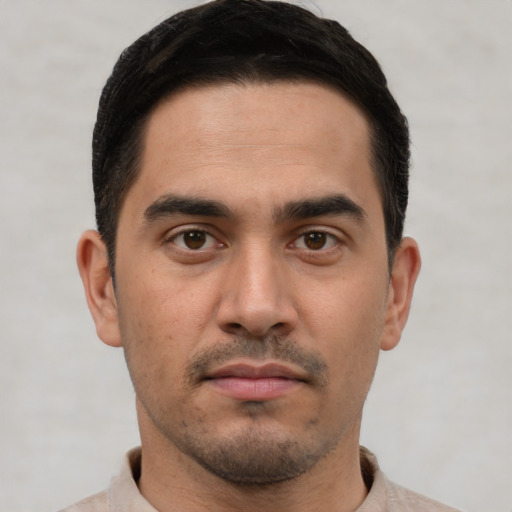 Neutral white young-adult male with short  brown hair and brown eyes