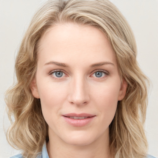 Joyful white young-adult female with medium  brown hair and blue eyes