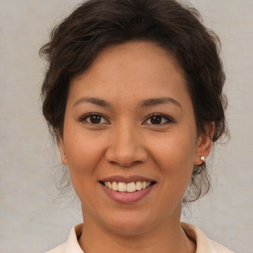Joyful white young-adult female with medium  brown hair and brown eyes