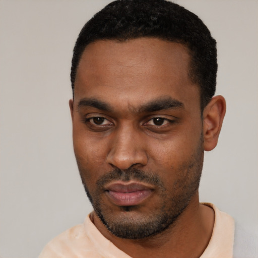 Neutral black young-adult male with short  black hair and brown eyes