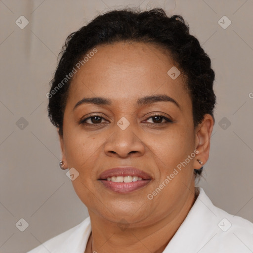 Joyful latino adult female with short  brown hair and brown eyes