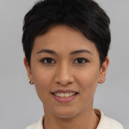 Joyful asian young-adult female with short  black hair and brown eyes