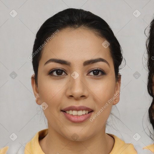 Joyful white young-adult female with medium  black hair and brown eyes