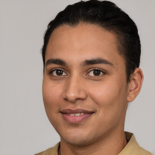 Joyful white young-adult male with short  black hair and brown eyes