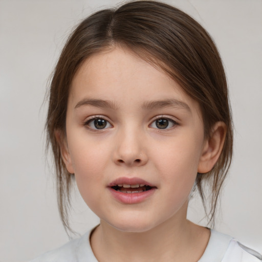 Joyful white child female with medium  brown hair and brown eyes