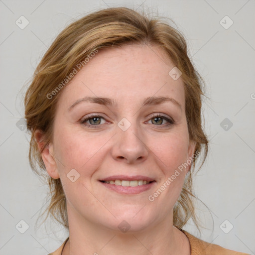 Joyful white adult female with medium  brown hair and blue eyes