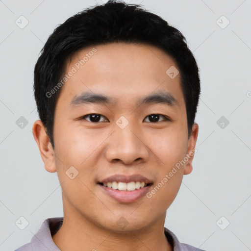 Joyful asian young-adult male with short  black hair and brown eyes