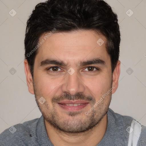 Joyful white young-adult male with short  black hair and brown eyes