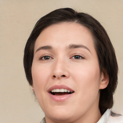 Joyful white young-adult female with medium  brown hair and brown eyes