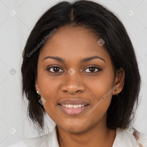 Joyful black young-adult female with long  brown hair and brown eyes