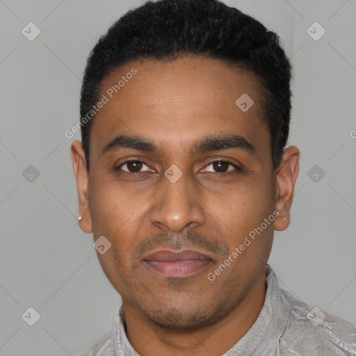 Joyful latino young-adult male with short  black hair and brown eyes