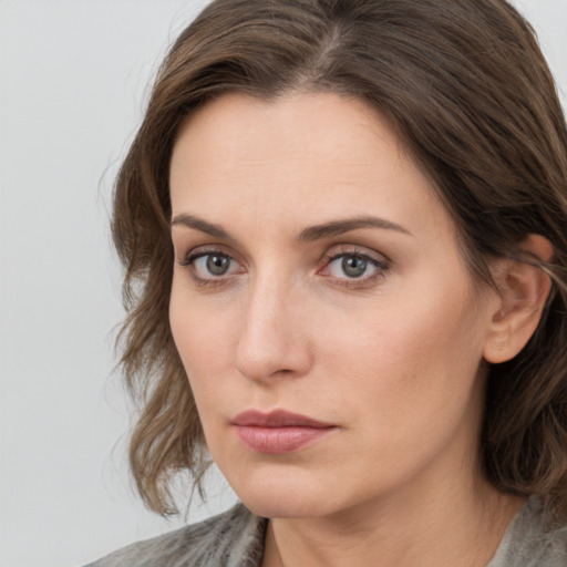 Neutral white young-adult female with medium  brown hair and grey eyes