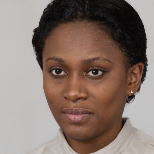 Neutral black young-adult female with short  black hair and brown eyes