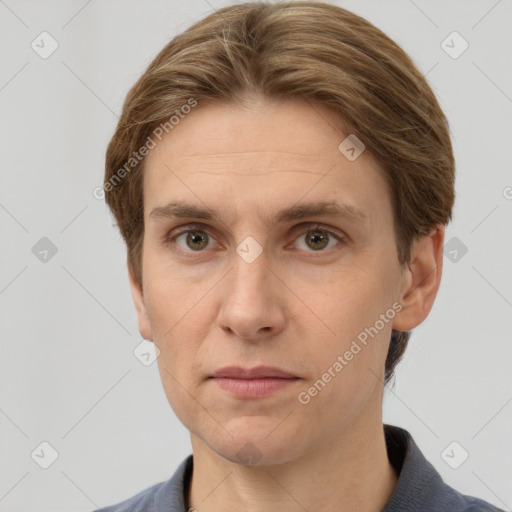 Joyful white adult male with short  brown hair and grey eyes