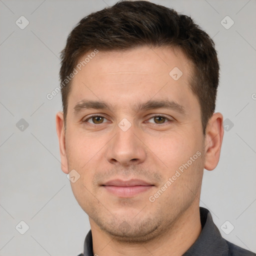 Joyful white young-adult male with short  brown hair and brown eyes