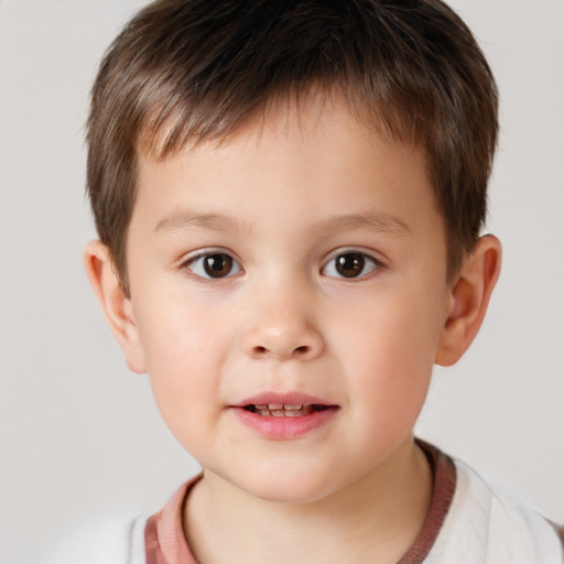 Joyful white child male with short  brown hair and brown eyes