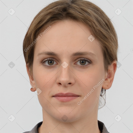 Joyful white young-adult female with short  brown hair and grey eyes