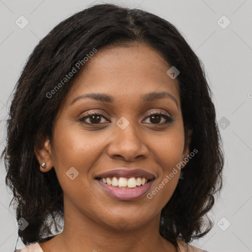 Joyful black young-adult female with medium  brown hair and brown eyes