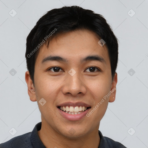 Joyful asian young-adult male with short  black hair and brown eyes