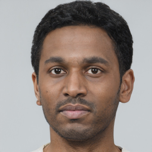 Neutral black young-adult male with short  black hair and brown eyes