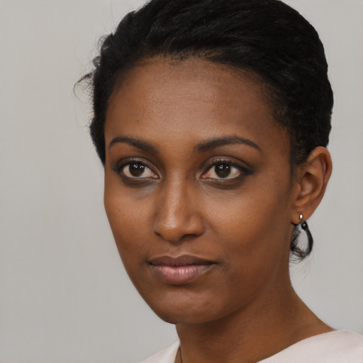 Neutral black young-adult female with short  black hair and brown eyes