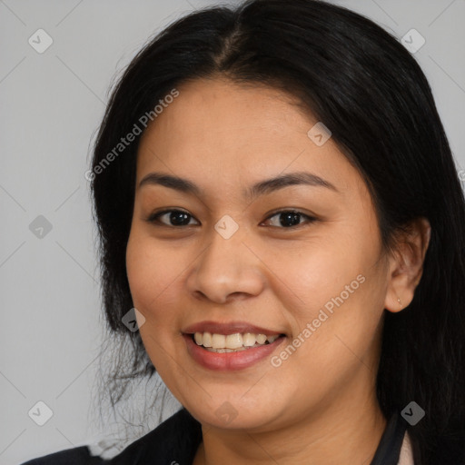 Joyful latino young-adult female with medium  brown hair and brown eyes