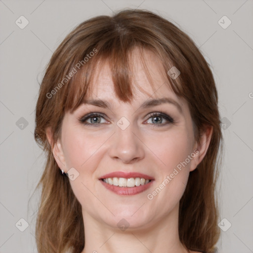 Joyful white young-adult female with medium  brown hair and blue eyes