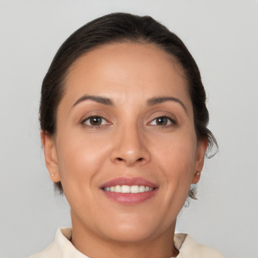 Joyful white young-adult female with medium  brown hair and brown eyes