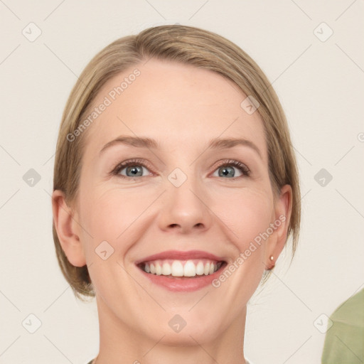 Joyful white young-adult female with medium  brown hair and green eyes