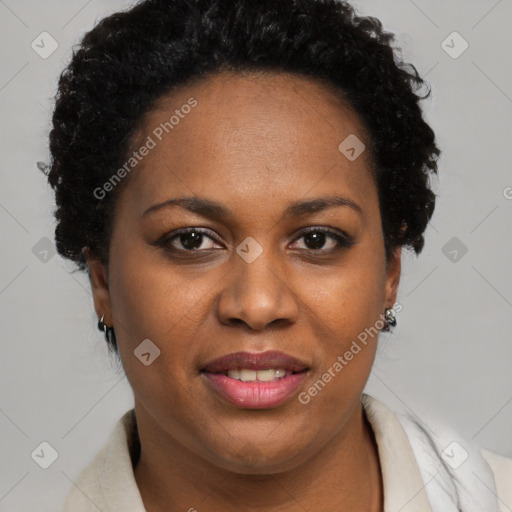 Joyful black adult female with short  brown hair and brown eyes