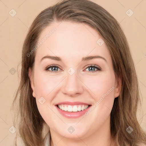 Joyful white young-adult female with medium  brown hair and green eyes