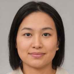 Joyful asian young-adult female with medium  brown hair and brown eyes