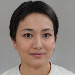 Joyful asian young-adult female with short  brown hair and brown eyes