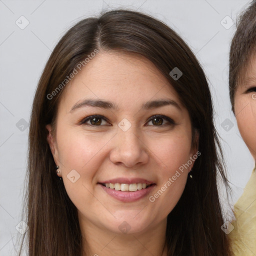 Joyful white young-adult female with long  brown hair and brown eyes