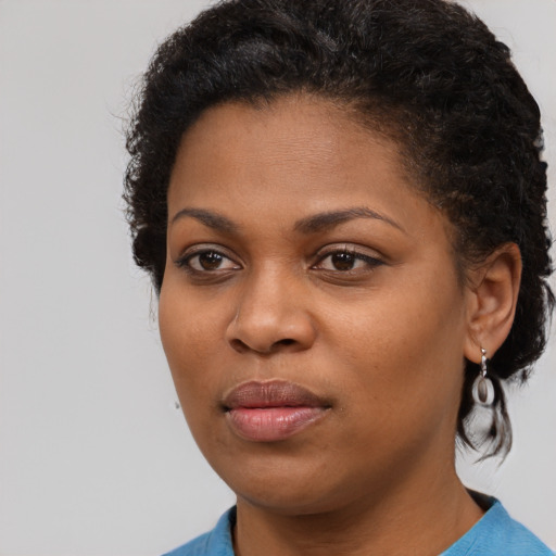 Neutral black young-adult female with short  brown hair and brown eyes