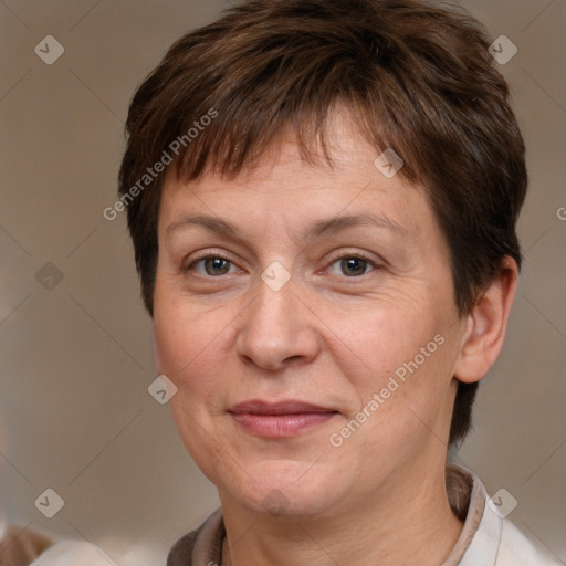 Joyful white adult female with short  brown hair and brown eyes