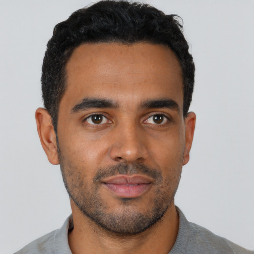 Neutral black young-adult male with short  black hair and brown eyes