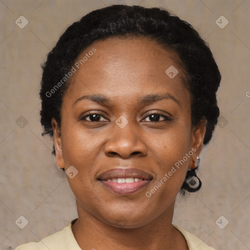 Joyful black adult female with short  black hair and brown eyes