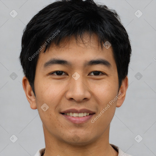 Joyful asian young-adult male with short  brown hair and brown eyes