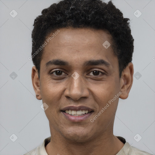 Joyful black young-adult male with short  black hair and brown eyes