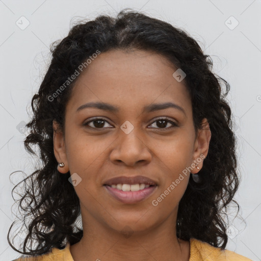 Joyful black young-adult female with long  brown hair and brown eyes